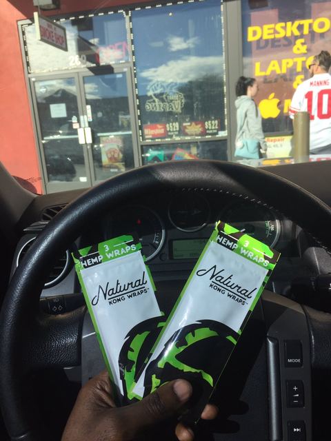 Cigarette Packs + Steering Wheel — Vehicle Gas-Station Moment