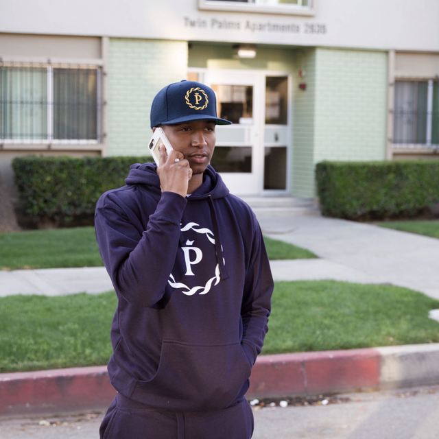 Armand Perry (CBA Peez) in PRCZN (Precision) Blue Sweatshirt + Navy PRCZN Hat