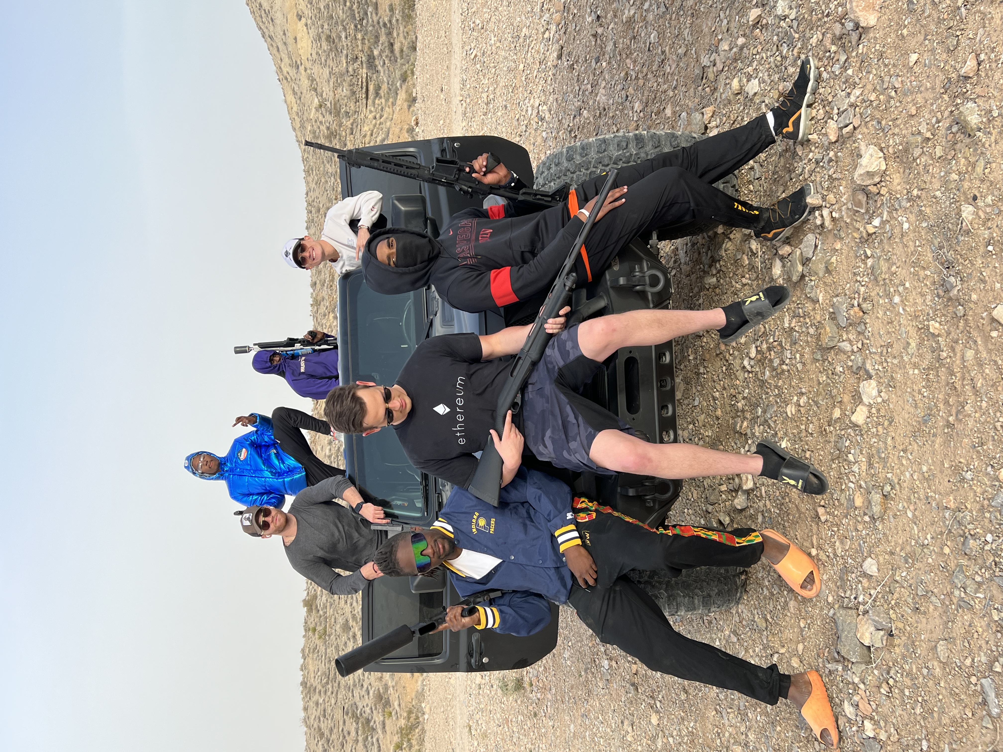 Group photo with Cybertruck in the desert